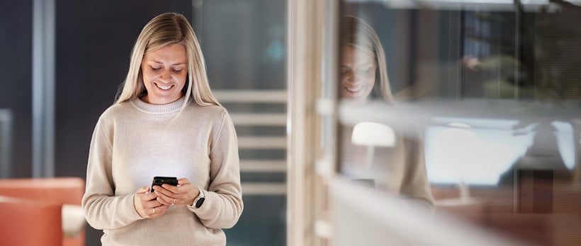 a woman looking at her phone