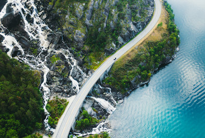 Car driving along a coastal road